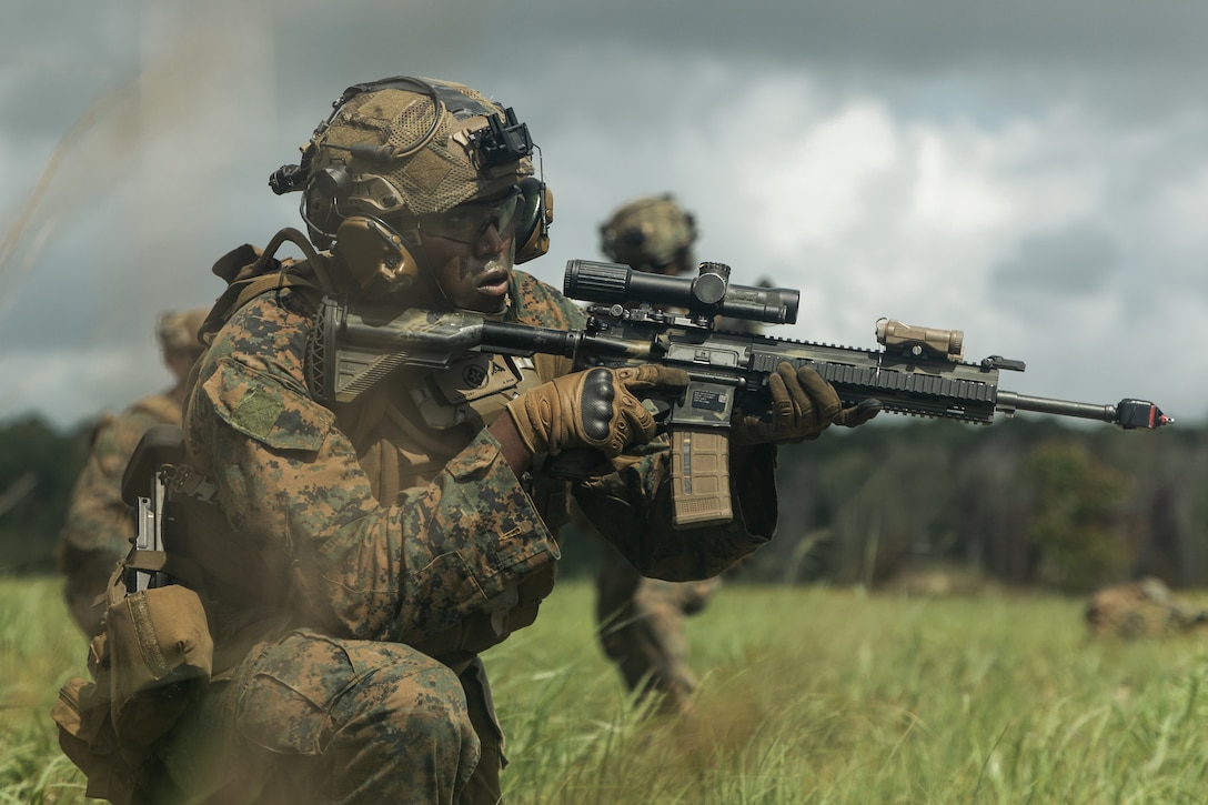 U.S. Marine Corps Lance Cpl. Jaylee Lul, a rifleman with Lima Company, Battalion Landing Team 3/6, 22nd Marine Expeditionary Unit, holds security during an amphibious assault as part of Composite Training Unit Exercise (COMPTUEX), on Marine Corps Base Camp Lejeune, North Carolina, July 9, 2025. During COMPTUEX, the Iwo Jima Amphibious Ready Group and 22nd MEU refine tactics, techniques, and procedures to execute warfighting functions that enhance operational readiness and lethality as a unified IWOARG/22 MEU team. (U.S. Marine Corps photo by Cpl. Maurion Moore)