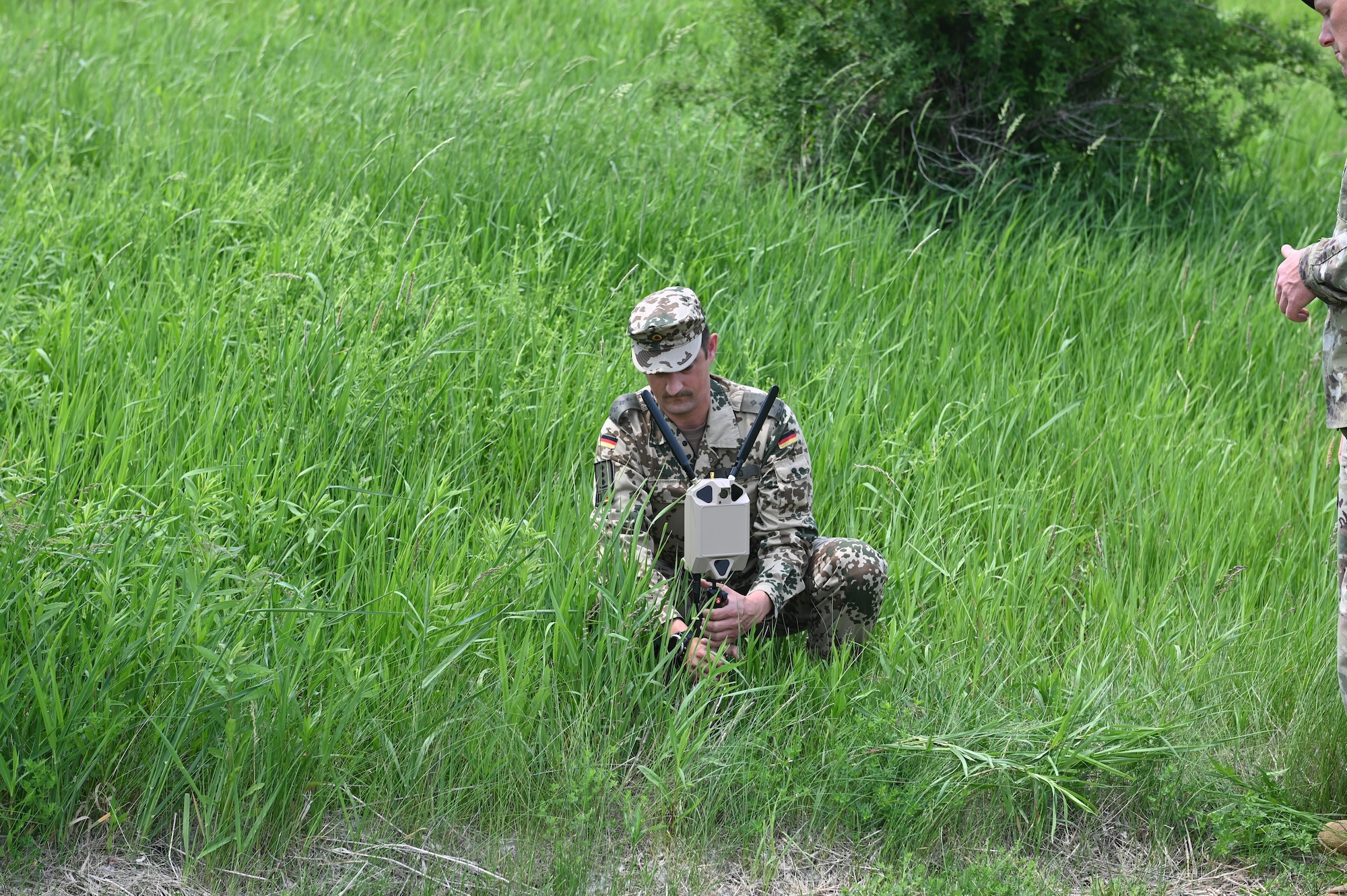 German Air Force Capt. Matthias Lang, Bravo Platoon Leader assigned to the 10th Company Home Defense Force Regiment #1, Germany, sets up a mobile security kit during the Military Reserve Exchange Program at Dane County Law Enforcement Training Center in Deforest, Wisconsin, June 10, 2025. The MREP provides an opportunity for professional development by allowing participants to train in a duty assignment similar to wartime. (U.S. Air National Guard photo by Ms. Fallon Riley)