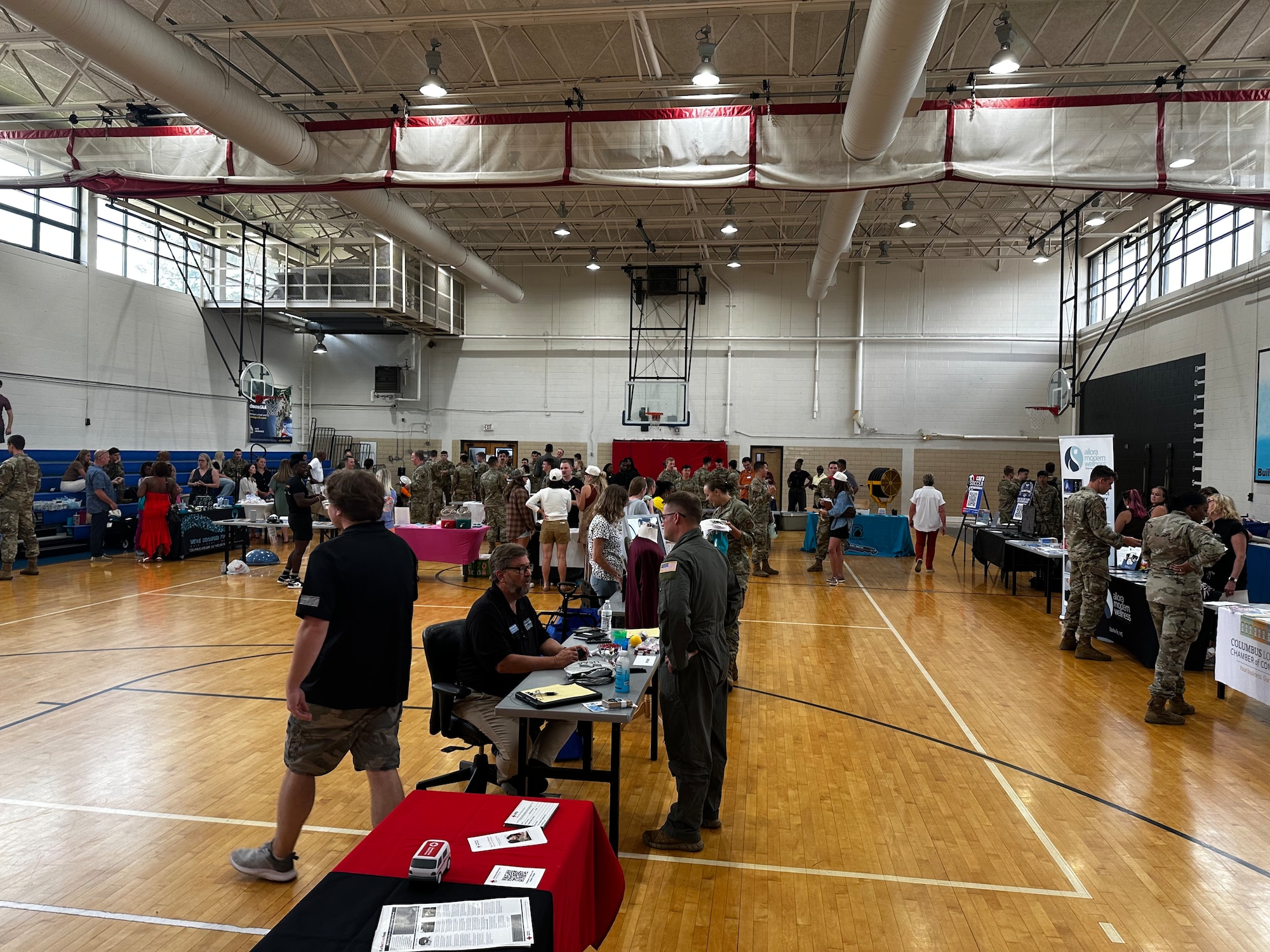 Airmen and families attend the Team 14 Community Connections info fair during the Newcomers Orientation at Columbus Air Force Base, Mississippi, July 16, 2025.