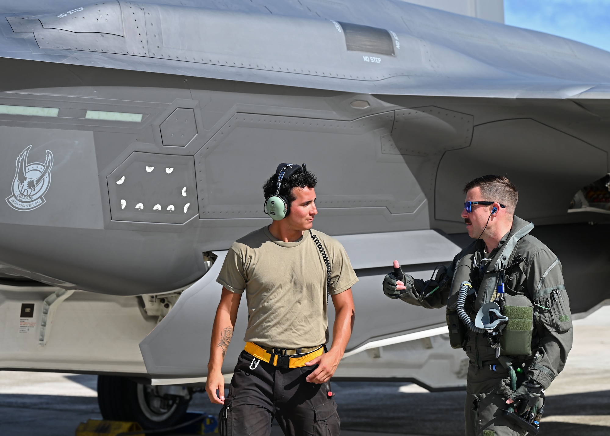 U.S. Air Force Lt. Col. Erik Gonsalves, 355th Mission Generation Force Element commander, speaks to U.S. Air Force Senior Airman Julian Martinez, 354th Air Expeditionary Wing assistant dedicated crew chief, before a flight during exercise Resolute Force Pacific (REFORPAC) 2025, July 17, 2025.