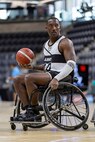 U.S. Army Master Sgt. Earlie Brown looks for an open teammate to pass to in a wheelchair basketball game during the 2025 Department of Defense Warrior Games at Colorado Springs, Colorado, July 19, 2025.