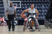 U.S. Army Spc. Anthony Farve brings the ball up court in a wheelchair basketball game during the 2025 Department of Defense Warrior Games at Colorado Springs, Colorado, July 19, 2025.