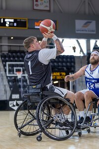 U.S. Army Staff Sgt. Tyler Pollard takes a shot in the wheelchair basketball game against Team Air Force during the 2025 Department of Defense Warrior Games at Colorado Springs, Colorado, July 19, 2025.