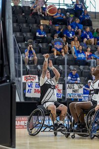 U.S. Army Staff Sgt. Tyler Pollard shoots the basketball in the wheelchair basketball game against Team Air Force during the 2025 Department of Defense Warrior Games at Colorado Springs, Colorado, July 19, 2025.