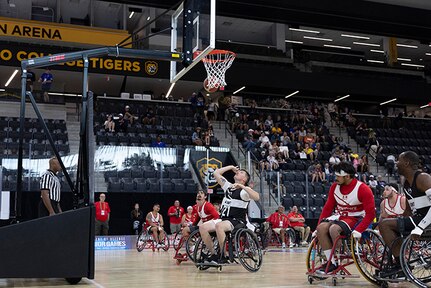 U.S. Army Staff Sgt. Coty Tuck takes a shot in the wheelchair basketball game against Team Marine Corps during the 2025 Department of Defense Warrior Games at Colorado Springs, Colorado, July 19, 2025.
