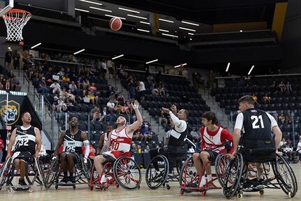 U.S. Army Capt. Carlos Rivera takes the shot during a wheelchair basketball game against Team Marine Corps during the 2025 Department of Defense Warrior Games at Colorado Springs, Colorado, July 19, 2025.