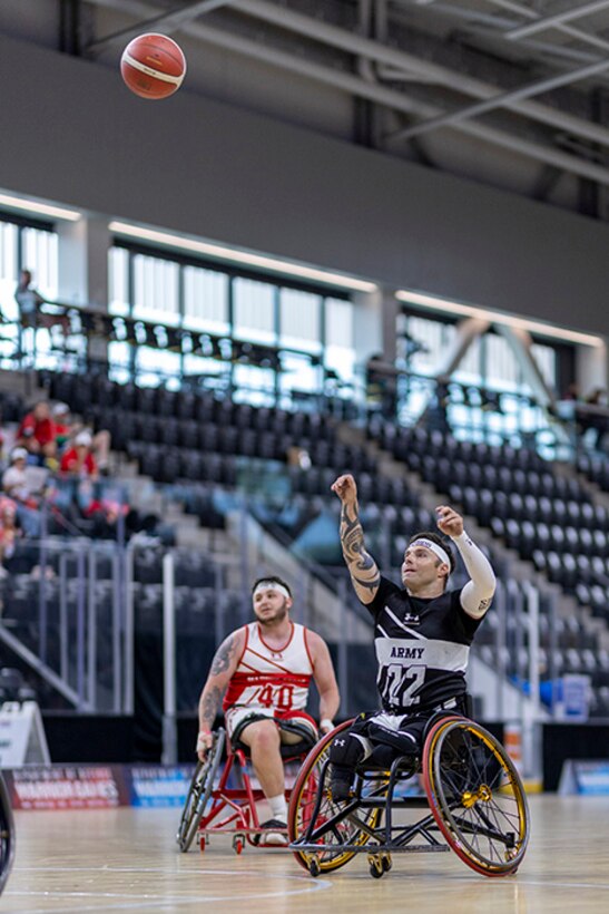 Retired U.S. Army Spc. JP Lane shoots the ball in the wheelchair basketball event during the 2025 Department of Defense Warrior Games at Colorado Springs, Colorado, July 19, 2025.