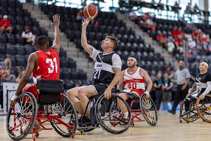 U.S. Army Staff Sgt. Coty Tuck takes a shot in the wheelchair basketball game against Team Marine Corps during the 2025 Department of Defense Warrior Games at Colorado Springs, Colorado, July 19, 2025.