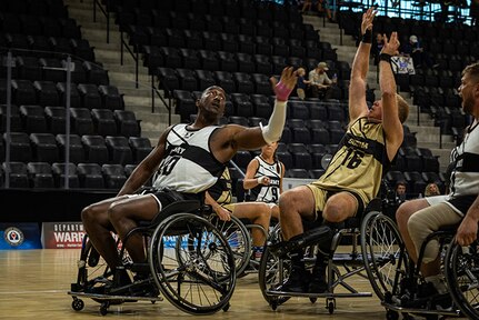 U.S. Army Master Sgt. Earlie Brown contests a shot during the wheelchair basketball game against Team SOCOM at the 2025 Department of Defense Warrior Games at Colorado Springs Colorado, July 19, 2025.