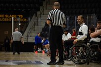 U.S. Army Capt. Carlos Rivera speaks to a referee before retrieving the ball to pass inbound during wheelchair basketball during the 2025 Department of Defense Warrior Games at Colorado Springs Colorado, July 19, 2025.