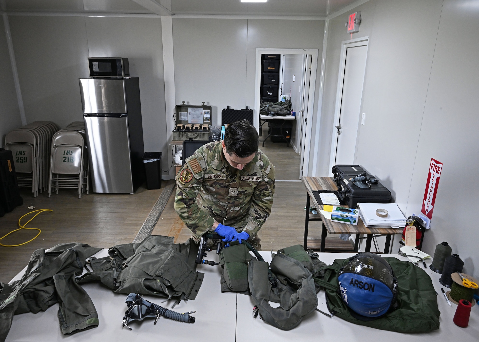 U.S. Air Force Senior Airman Evan William Petrosky, 354th Air Expeditionary Wing aircrew flight equipment technician, inspects a flightsuit to ensure it is serviceable during exercise Resolute Force Pacific (REFORPAC) 25, July 19, 2025.