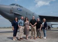 Members of the Association of Defense Communities and Minot Area Chamber Economic Development Corporation pose for a photo in front of a B-52H Stratofortress.