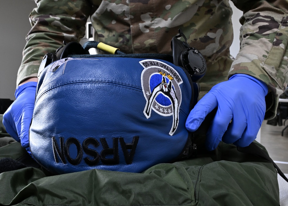 U.S. Air Force Senior Airman Evan William Petrosky, 354th Air Expeditionary Wing aircrew flight equipment technician, inspects an F-35A Lightning II helmet to ensure it is serviceable during exercise Resolute Force Pacific (REFORPAC) 25, July 12, 2025.