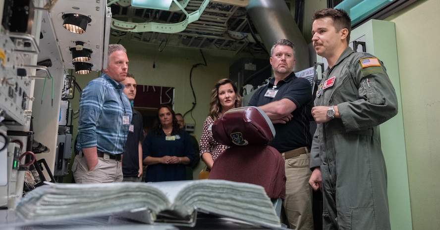 Members of the Association of Defense Communities and Minot Area Chamber Economic Development Corporation receive a tour of a missile alert training facility.
