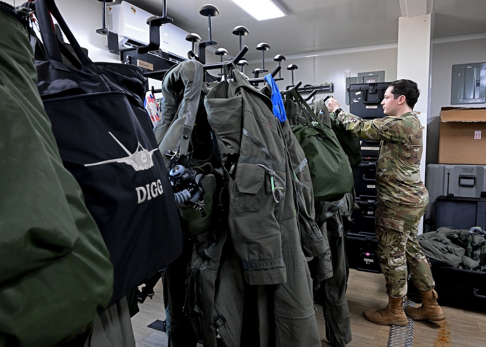 U.S. Air Force Senior Airman Evan William Petrosky, 354th Air Expeditionary Wing aircrew flight equipment technician, takes down flight gear for an inspection to ensure it is serviceable during exercise Resolute Force Pacific (REFORPAC) 25, July 21, 2025.