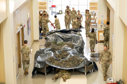 Airmen from the 49th Medical Group rotate between stations during a Medic-X exercise at Holloman Air Force Base, New Mexico, July 16, 2025.