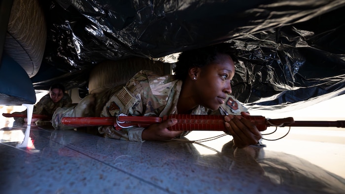 U.S. Air Force Airman 1st Class Da’Ja Thomas, 49th Healthcare Operations Squadron mental technician, low-crawls through an obstacle course during a Medic-X exercise at Holloman Air Force Base, New Mexico, July 16, 2025.