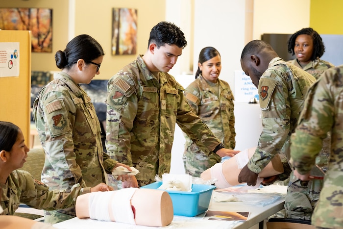 Airmen from the 49th Medical Group train on cleaning and covering wounds during a Medic-X exercise at Holloman Air Force Base, New Mexico, July 16, 2025.