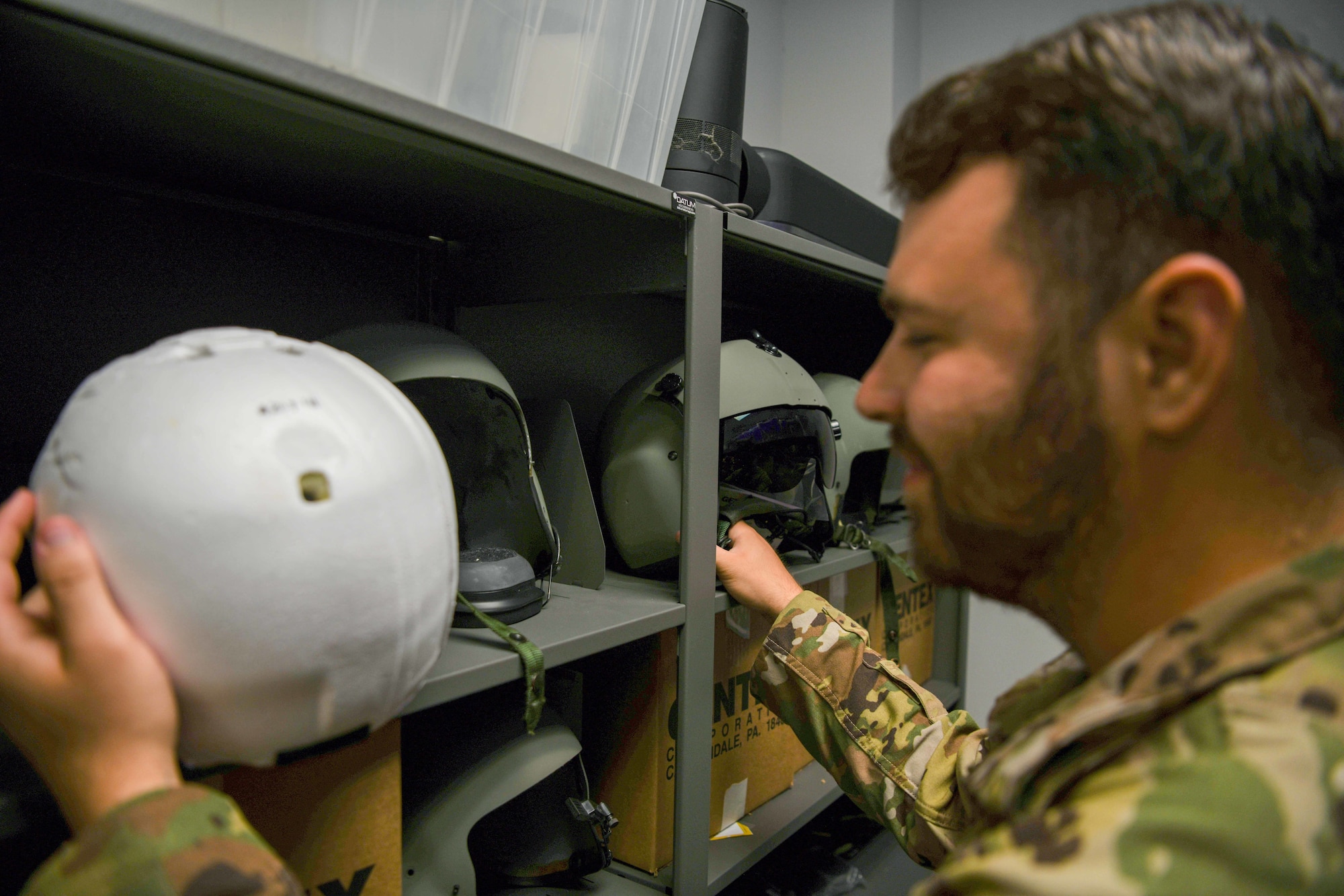 Airman inspects helmet