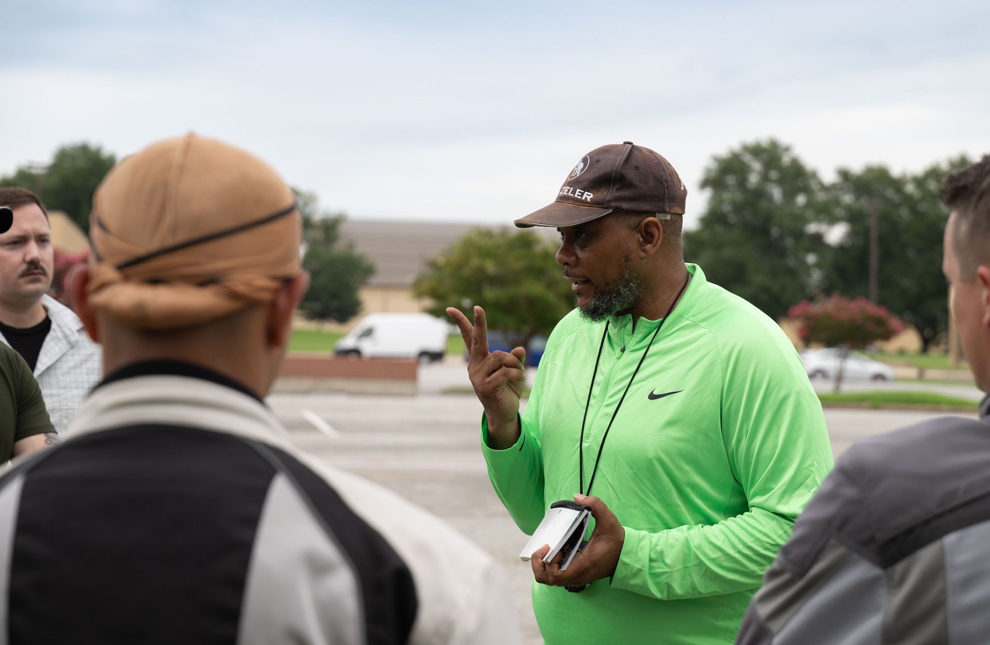Daryl Bagley, Air Force District of Washington senior Motorcycle Safety Foundations rider coach, explains a drill from the Basic RiderCourse 2 curriculum at Joint Base Andrews, Md., July 21, 2025.