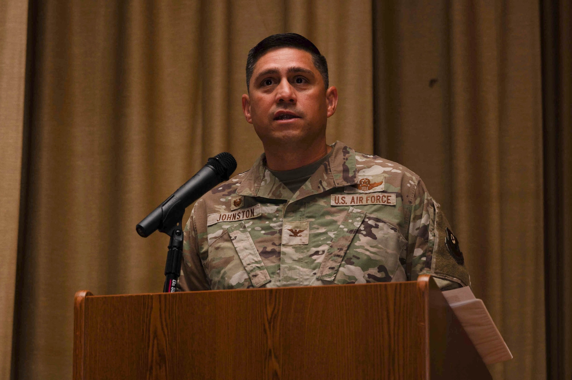 U.S. Air Force Col. Robert Johnston, 27th Special Operations Wing commander, delivers opening remarks during the change of responsibility ceremony at Cannon Air Force Base, New Mexico, July 21, 2025. U.S. Air Force Chief Master Sgt. Thomas Gunnell will serve as the principal advisor to Johnston on all matters of morale, welfare, professional development and combat readiness of the enlisted force, which accounts for 87% of Cannon’s service members. (U.S. Air Force photo by Staff Sgt. Kevin Williams)