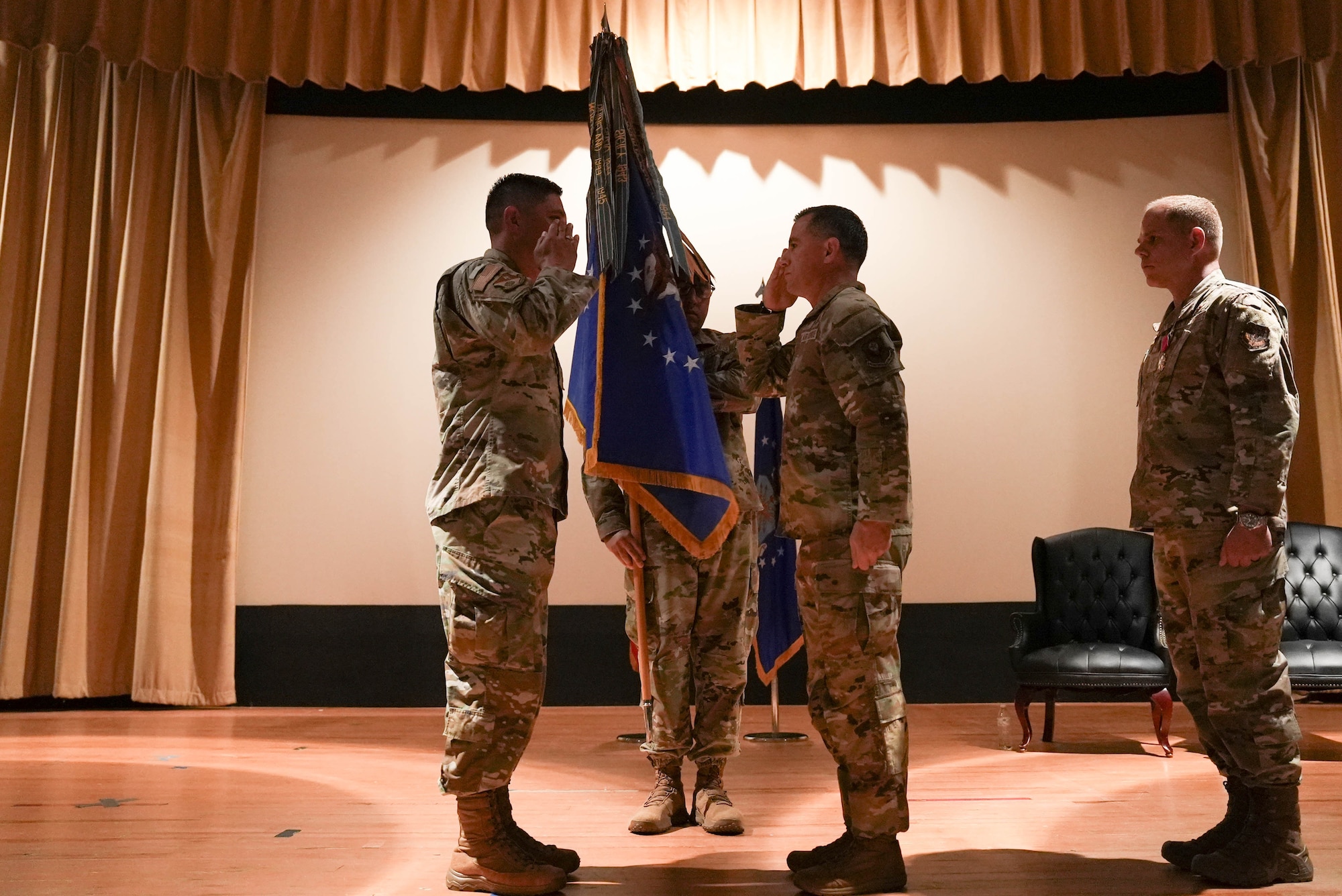 U.S. Air Force Chief Master Sgt. Thomas Gunnell (right), incoming 27th Special Operations Wing command chief, salutes U.S. Air Force Col. Robert Johnston (left), 27th SOW commander, during a change of responsibility ceremony at Cannon Air Force Base, New Mexico, July 21, 2025. Gunnell previously served as the 492nd Special Operations Wing command chief and is a tactical air control party superintendent with more than 300 combat missions on his