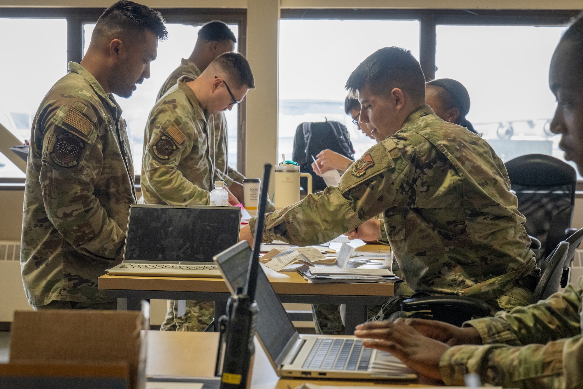 U.S. Air Force Airmen assigned to the 90th Fighter Generation Squadron, process through a personnel deployment function line to support exercise Resolute Force Pacific 2025, at Joint Base Elmendorf-Richardson, Alaska, July 11, 2025.