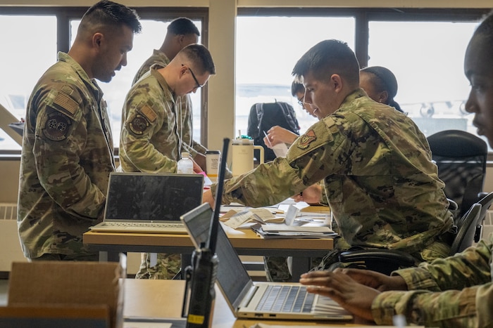 U.S. Air Force Airmen assigned to the 90th Fighter Generation Squadron, process through a personnel deployment function line to support exercise Resolute Force Pacific 2025, at Joint Base Elmendorf-Richardson, Alaska, July 11, 2025.