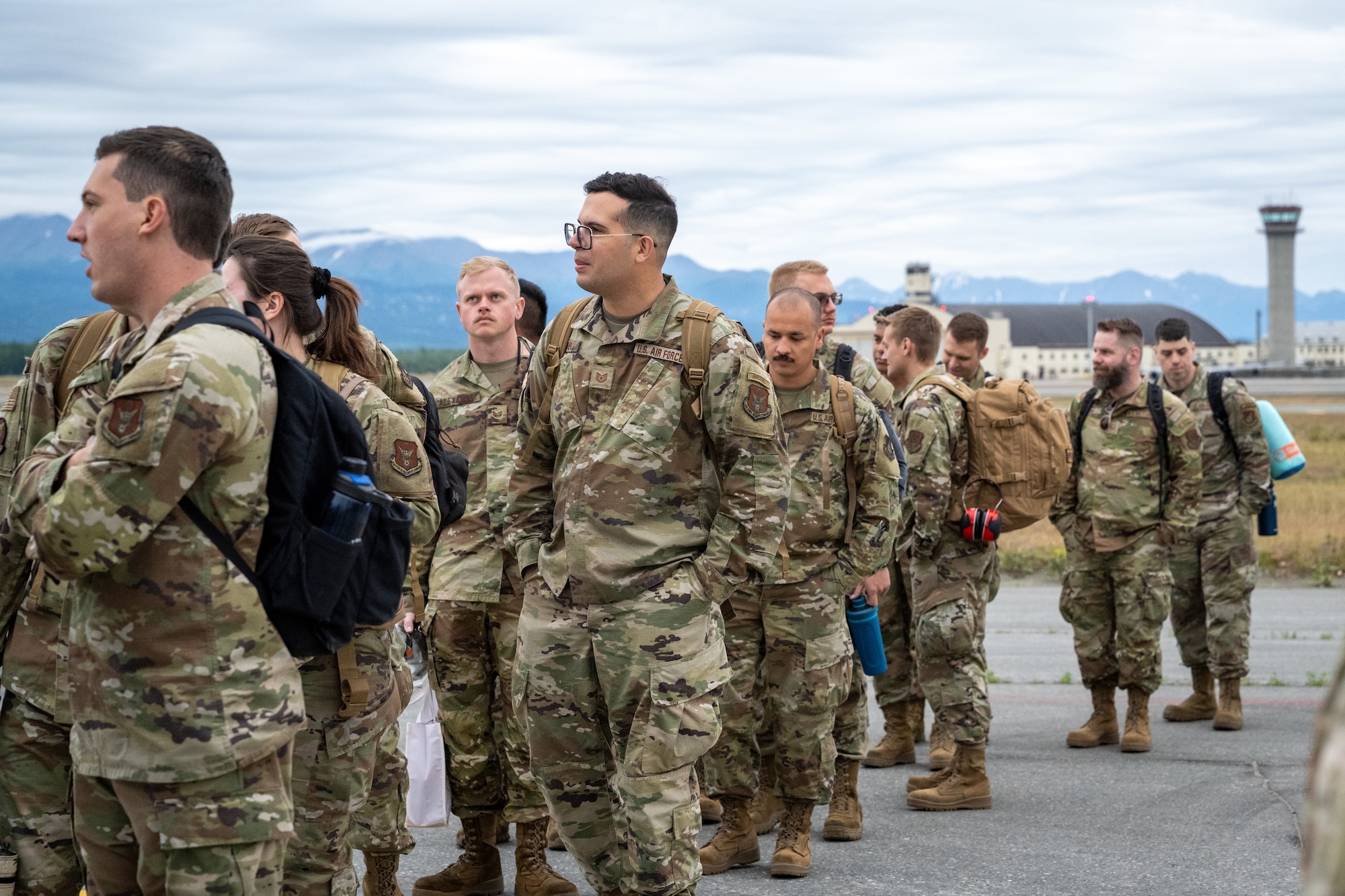U.S. Air Force Airmen assigned to the 3rd Air Expeditionary Wing prepare to board an aircraft in support of exercise Resolute Force Pacific at Joint Base Elmendorf-Richardson, Alaska, July 13, 2025.
