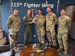 U.S. Air Force leadership assigned to the 115th Fighter Wing, Wisconsin Air National Guard, exchange pleasantries and gifts with German Air Force officers during a meet and greet for the Military Reserve Exchange Program at Truax Field in Madison, Wisconsin, June 9, 2025. The MREP provides an opportunity for professional development by allowing participants to train in a duty assignment similar to wartime. (U.S. Air National Guard photo by Master Sgt. Mary Greenwood)