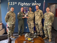 U.S. Air Force leadership assigned to the 115th Fighter Wing, Wisconsin Air National Guard, exchange pleasantries and gifts with German Air Force officers during a meet and greet for the Military Reserve Exchange Program at Truax Field in Madison, Wisconsin, June 9, 2025.