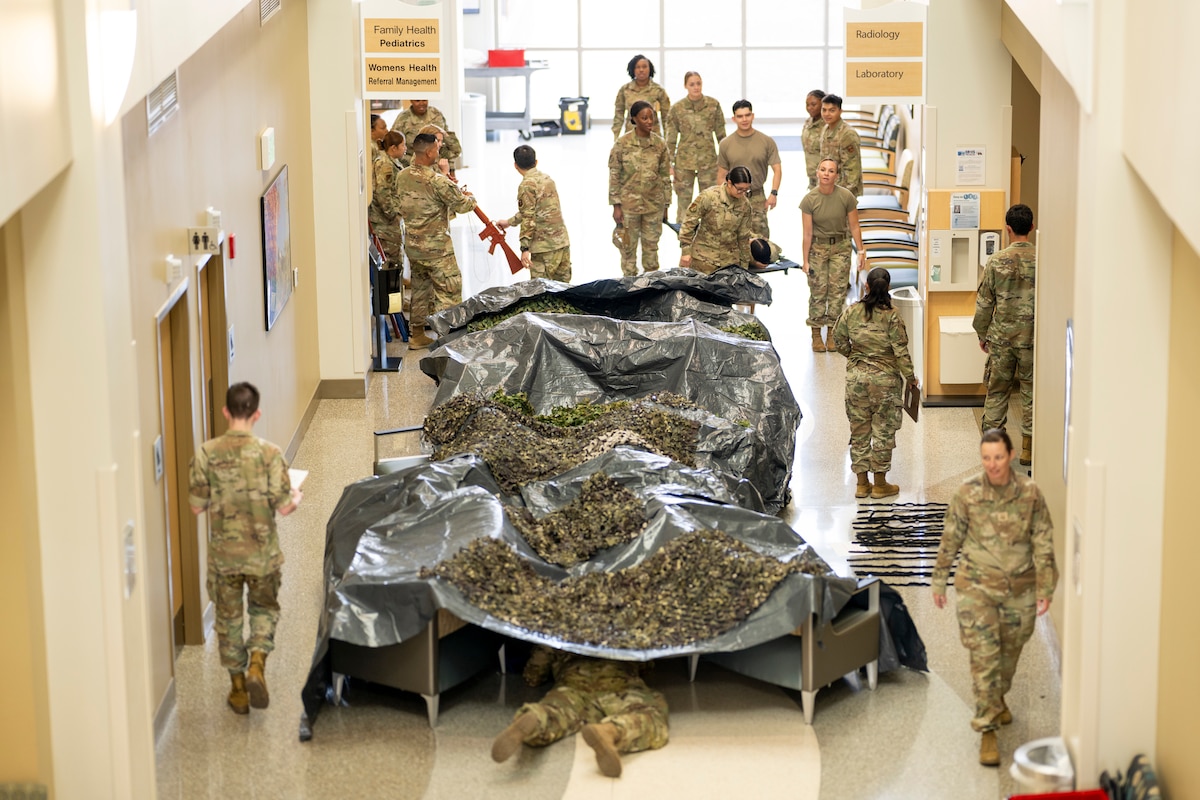Airmen from the 49th Medical Group rotate between stations during a Medic-X exercise at Holloman Air Force Base, New Mexico, July 16, 2025.