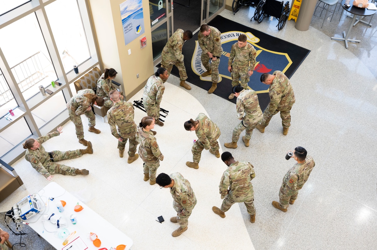 Medics from the 49th Medical Group self-apply turniquets during a Medic-X exercise at Holloman Air Force Base, New Mexico, July 16, 2025.