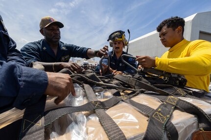 PUERTO PLATA, Dominican Republic (July 15, 2025) Sailors assigned to the Mercy-class hospital ship USNS Comfort (T-AH 20) load medical site cargo aboard Comfort in Puerto Plata, Dominican Republic during Continuing Promise 2025, July 15, 2025. Continuing Promise 2025 is the 16th iteration of the U.S. 4th Fleet/U.S. Naval Forces Southern Command-led Mission since 2007, which aims to foster goodwill, strengthen existing partnerships with partner nations, and form new partnerships between host nations, non-federal entities, and international organizations. (U.S. Navy photo by Mass Communication Specialist 2nd Class Alfredo Marron)