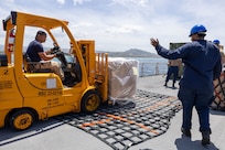 PUERTO PLATA, Dominican Republic (July 15, 2025) Sailors and Military Sealift Command personnel assigned to the Mercy-class hospital ship USNS Comfort (T-AH 20) load medical site cargo aboard Comfort in Puerto Plata, Dominican Republic during Continuing Promise 2025, July 15, 2025. Continuing Promise 2025 is the 16th iteration of the U.S. 4th Fleet/U.S. Naval Forces Southern Command-led Mission since 2007, which aims to foster goodwill, strengthen existing partnerships with partner nations, and form new partnerships between host nations, non-federal entities, and international organizations. (U.S. Navy photo by Mass Communication Specialist 2nd Class Alfredo Marron)