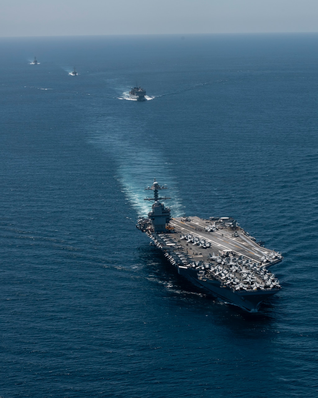 The world's largest aircraft carrier, USS Gerald R. Ford (CVN 78), Spanish Navy Santa Maria-class frigate ESPS Canarias (F86), fast combat support ship USNS Supply (T-AOE 6), and Arleigh Burke-class guided-missile destroyer USS Winston S. Churchill (DDG 81), transit the Strait of Gibraltar, July 17, 2025. Gerald R. Ford, a first-in-class aircraft carrier and deployed flagship of Carrier Strike Group Twelve, is on a scheduled deployment in the U.S. 6th Fleet area of operations to support the warfighting effectiveness, lethality, and readiness of U.S. Naval Forces Europe-Africa, and defend U.S., Allied and partner interests in the region. (U.S. Navy photo by Mass Communication Specialist 2nd Class Jacob Mattingly)