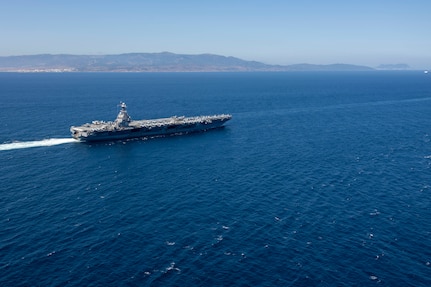 The world's largest aircraft carrier, USS Gerald R. Ford (CVN 78), transits the Strait of Gibraltar, July 17, 2025. Gerald R. Ford, a first-in-class aircraft carrier and deployed flagship of Carrier Strike Group Twelve, is on a scheduled deployment in the U.S. 6th Fleet area of operations to support the warfighting effectiveness, lethality, and readiness of U.S. Naval Forces Europe-Africa, and defend U.S., Allied and partner interests in the region. (U.S. Navy photo by Mass Communication Specialist 2nd Class Jacob Mattingly)