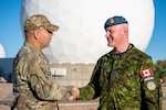 From left to right, Col. Miguel Cruz, Space Delta 4 commander, shakes hands with Brig. Gen. Kyle Paul,Deputy Commanding General, Transformation, Space Operations Command, within the restricted area at Buckley Space Force Base, Colo., Oct. 11, 2022. Paul received multiple briefings from members of
various space warning squadrons supporting Space Delta 4. (U.S. Space Force photo by Airman 1st Class Shaun Combs)
