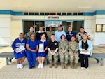 NUKU’ALOFA, Tonga (June 24, 2025) U.S. service members deployed in support of Pacific Partnership 2025 (PP-25), and local healthcare workers at Mu’a Health Centre pose for a group photo during PP-25 in Nuku’Alofa, Tonga, June 24, 2025. Now in its 21st iteration, the Pacific Partnership series is the largest annual multinational humanitarian assistance and disaster management preparedness mission conducted in the Indo-Pacific. Pacific Partnership works collaboratively with host and partner nations to enhance regional interoperability and disaster response capabilities, increase security and stability in the region, and foster new and enduring friendships in the Indo-Pacific. (U.S. Navy photo by Courtesy Asset/Released)