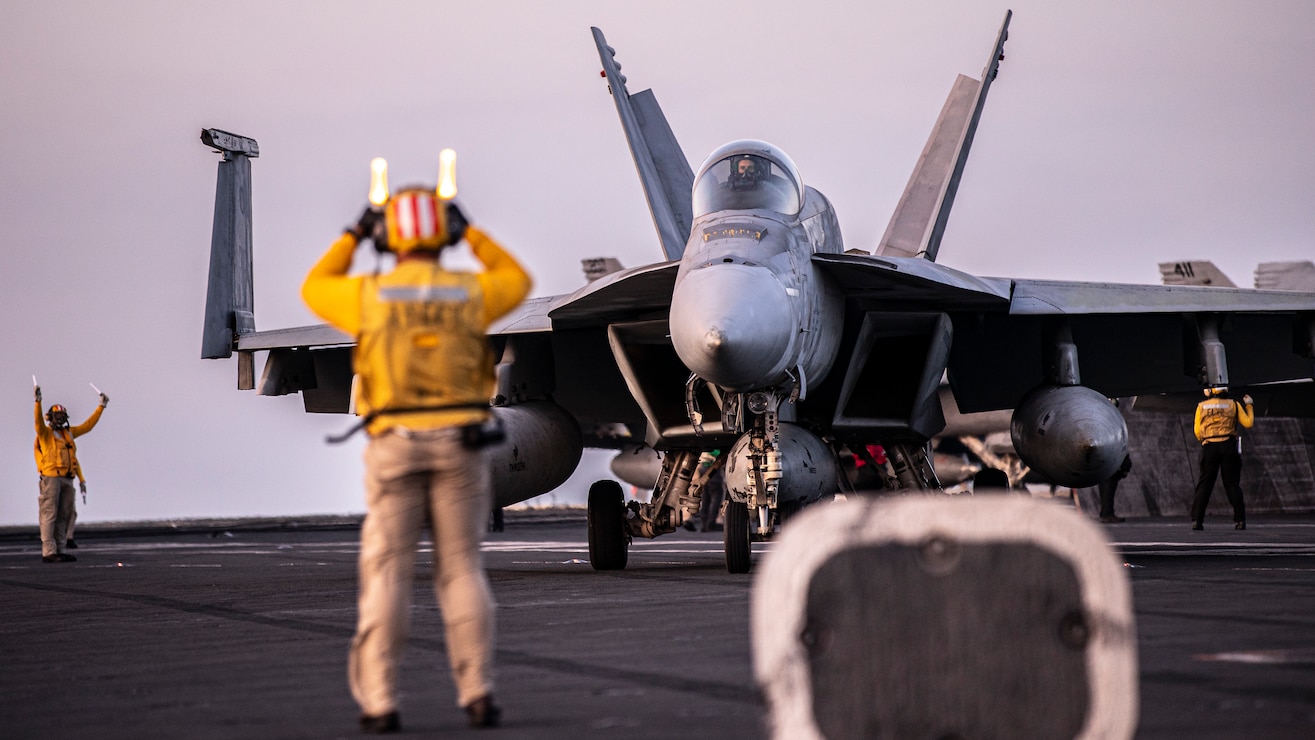 An F/A-18E Super Hornet, attached to Strike Fighter Squadron (VFA) 195, taxis on the flight deck of the Nimitz-class aircraft carrier USS George Washington (CVN 73) while underway in the Timor Sea, July 16, 2025, in support of Talisman Sabre. Talisman Sabre is the largest bilateral military exercise between Australia and the United States advancing a free and open Indo-Pacific by strengthening relationships and interoperability among key allies and partners, while enhancing our collective capabilities to respond to a wide array of potential security concerns. (U.S. Navy photo by Mass Communication Specialist Seaman Nicolas Quezada)
