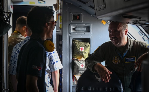 Flight engineer speaks with participant about career.
