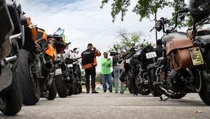 Daryl Bagley, Air Force District of Washington senior Motorcycle Safety Foundations rider coach, provides feedback to riders during the Basic RiderCourse 2 at Joint Base Andrews, Md., July 21, 2025.
