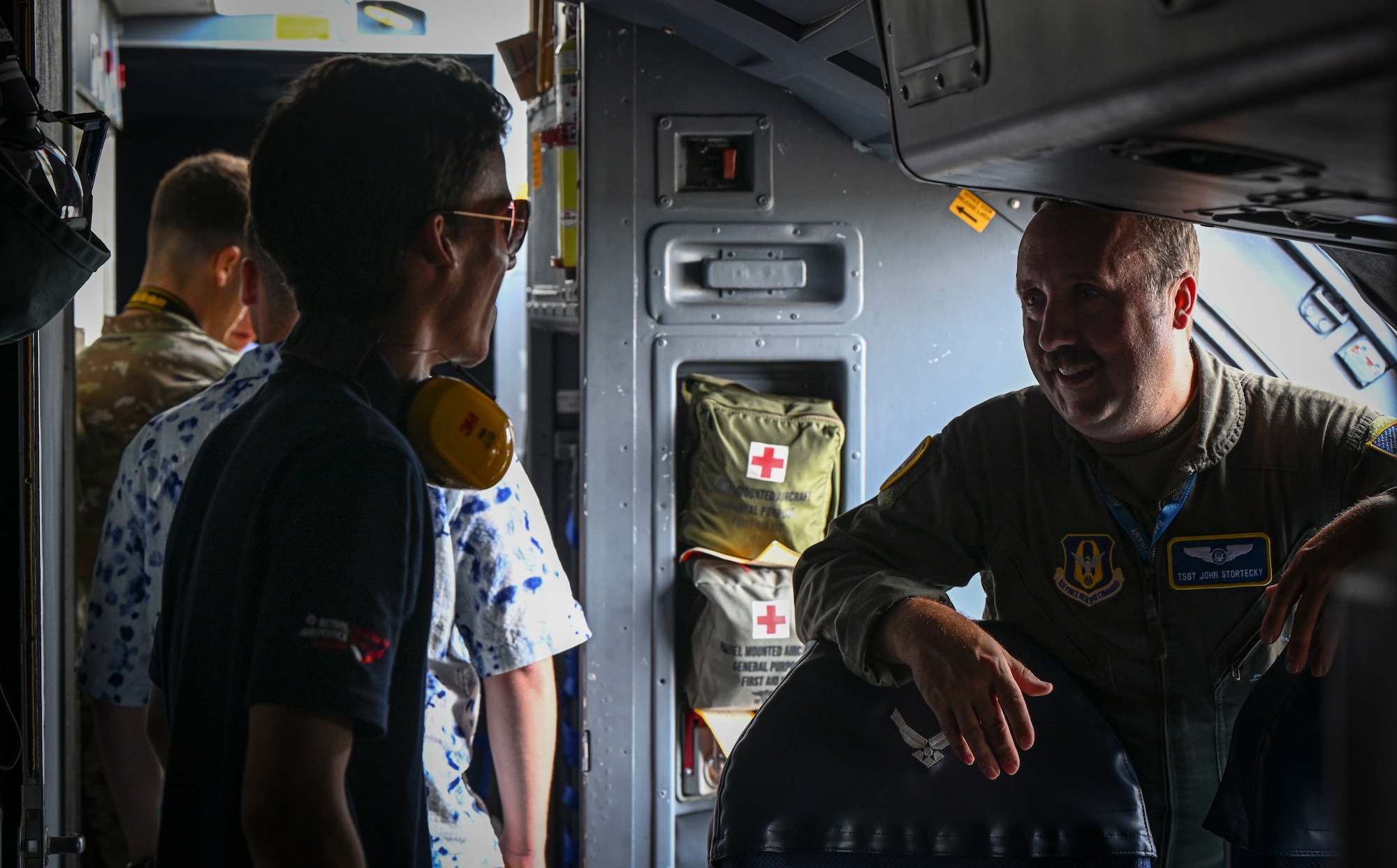 Flight engineer speaks with participant about career.