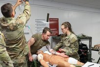U.S. Soldiers with the 108th Medical Company Area Support, 213th Regional Support Group, Pennsylvania Army National Guard, pull simulated casualties from a simulated helicopter crash at Fort Indiantown Gap, Pennsylvania, July 18, 2025.