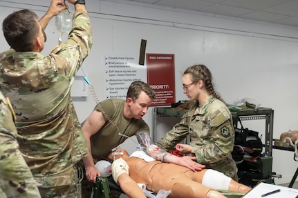 U.S. Soldiers with the 108th Medical Company Area Support, 213th Regional Support Group, Pennsylvania Army National Guard, pull simulated casualties from a simulated helicopter crash at Fort Indiantown Gap, Pennsylvania, July 18, 2025.