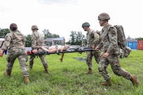U.S. Soldiers with the 108th Medical Company Area Support, 213th Regional Support Group, Pennsylvania Army National Guard, pull simulated casualties from a simulated helicopter crash at Fort Indiantown Gap, Pennsylvania, July 18, 2025.