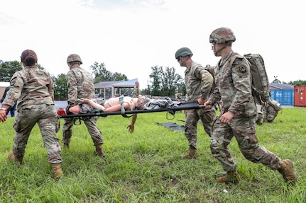 U.S. Soldiers with the 108th Medical Company Area Support, 213th Regional Support Group, Pennsylvania Army National Guard, pull simulated casualties from a simulated helicopter crash at Fort Indiantown Gap, Pennsylvania, July 18, 2025.