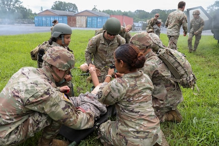 U.S. Soldiers with the 108th Medical Company Area Support, 213th Regional Support Group, Pennsylvania Army National Guard, pull simulated casualties from a simulated helicopter crash at Fort Indiantown Gap, Pennsylvania, July 18, 2025.