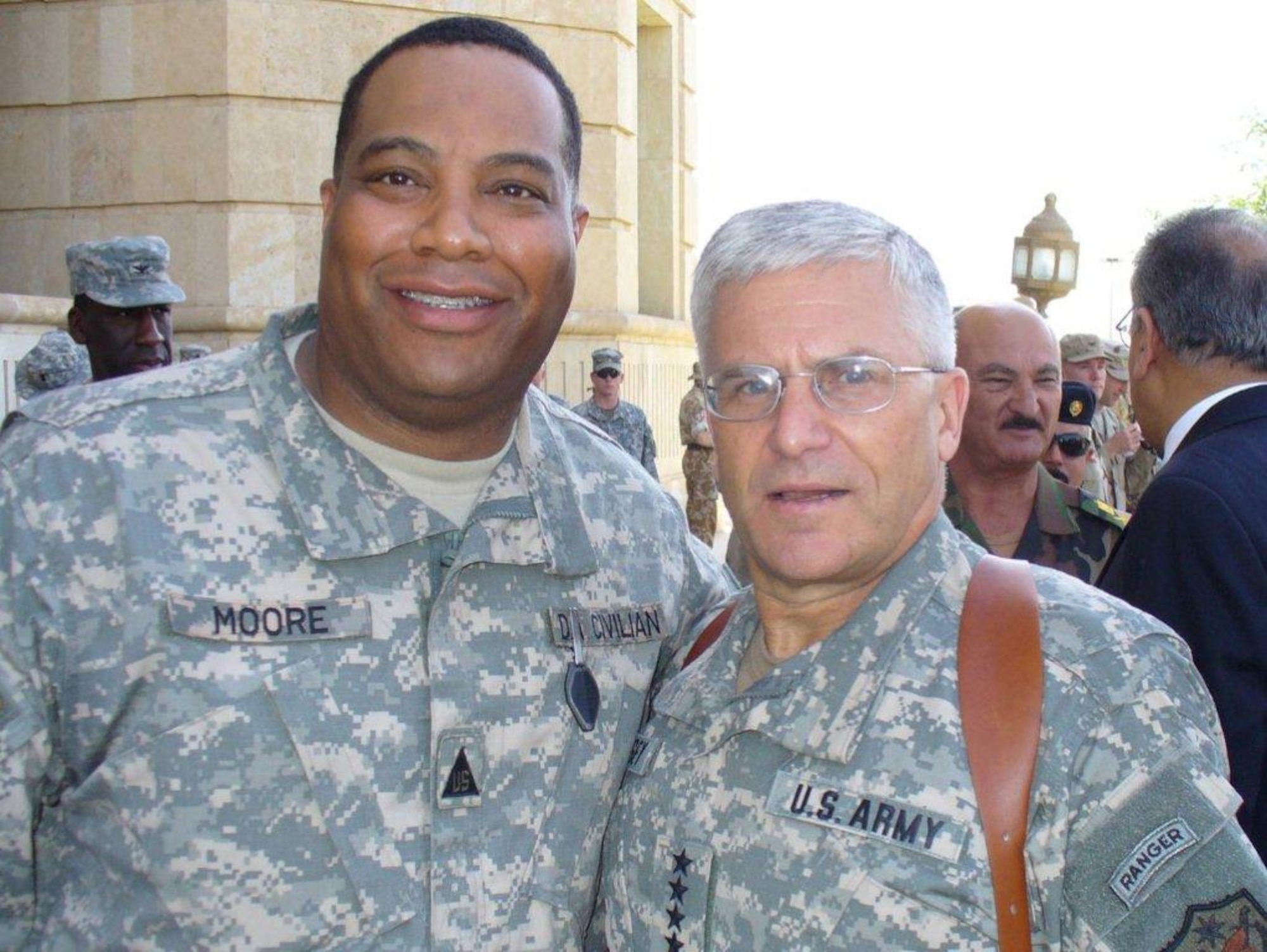 Cecil D. Moore, 86th Force Support Squadron vehicle control officer, poses for a photo with U.S. Army retired General George W. Casey, Jr., the 36th Chief of Staff of the U.S. Army.