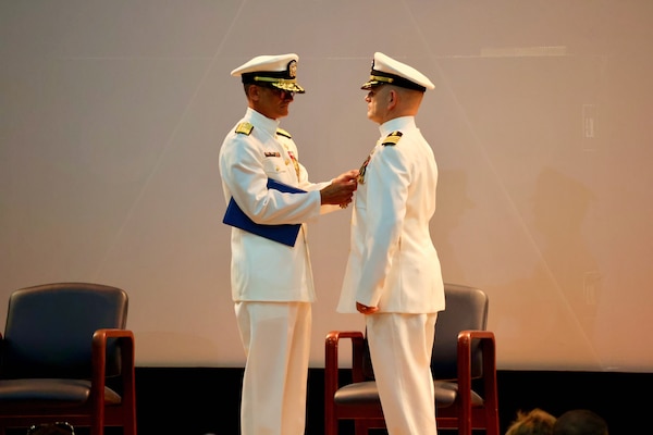 Navy Medicine Readiness and Training Command (NMRTC) Twentynine Palms marks a historic transition of leadership during a Change of Command and Retirement Ceremony held July 18, 2025, at the Marine Corps Air Ground Combat Center (MCAGCC) Theater. Capt. Janiese Cleckley relieved Capt. Daniel Clark as commanding officer of NMRTC Twentynine Palms and director of Naval Hospital Twentynine Palms. The event also included a retirement ceremony, as the command honored Clark’s 29 years of distinguished service in Navy Medicine (U.S. Navy photo by Christopher C. Jones, NHTP/NMRTC Twentynine Palms public affairs officer).